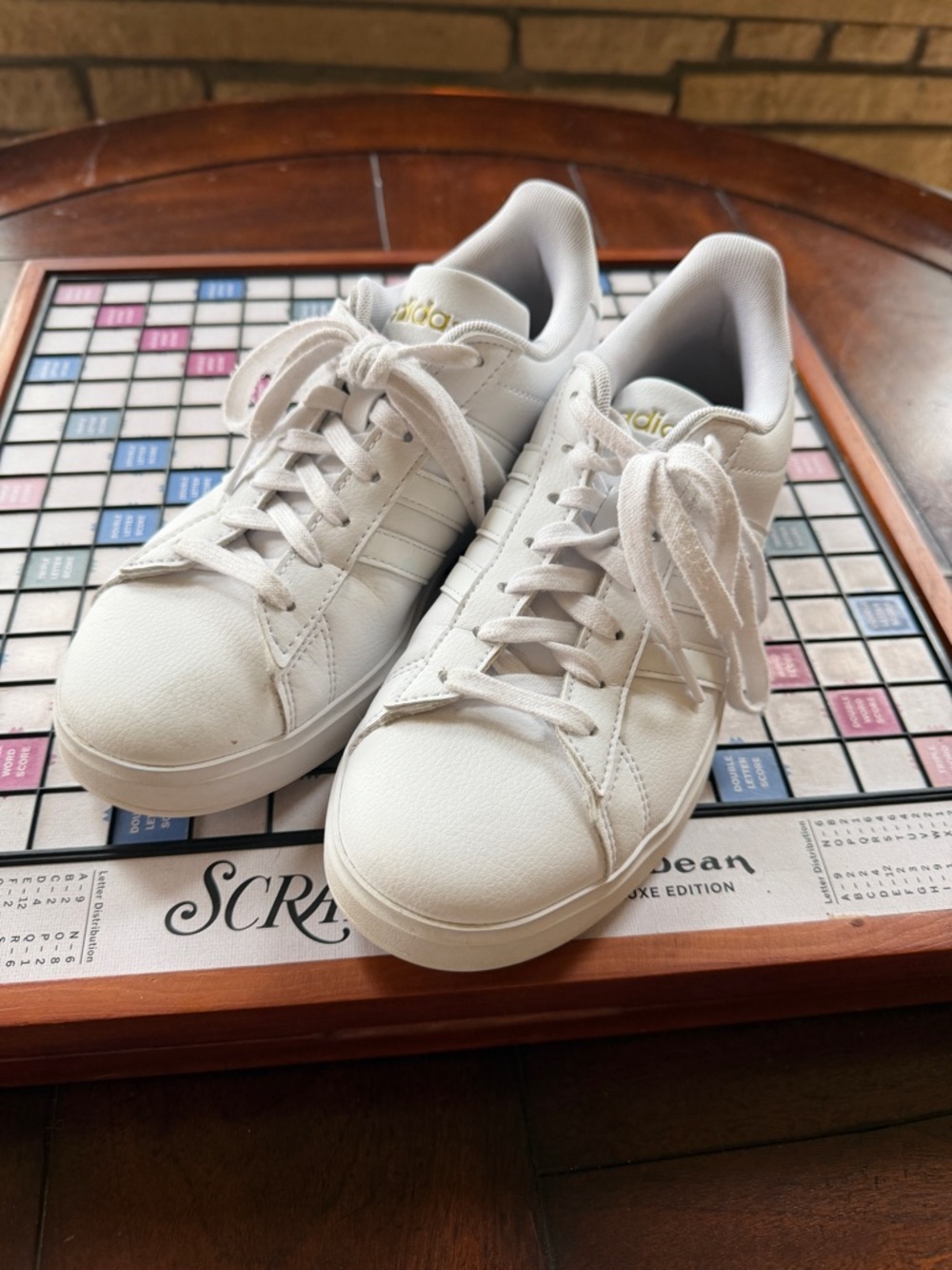 adidas White Low-Top Leather Sneakers with Gold Logo